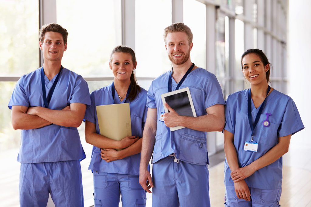 Nurses Standing & Smiling